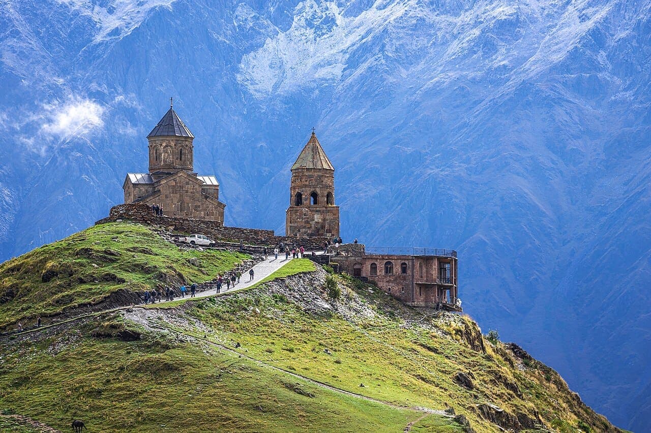 Gergeti Trinity Church and snowy mountains in Kazbegi