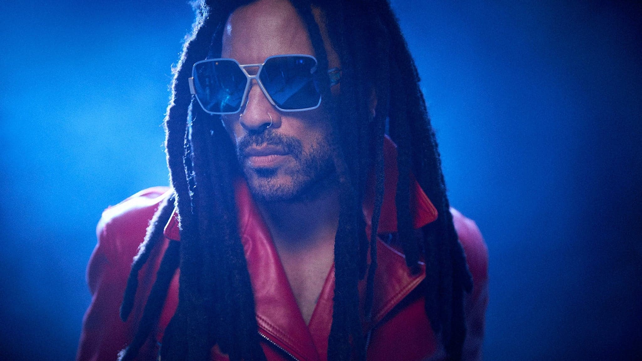 Lenny Kravitz with his guitar at a live rock concert