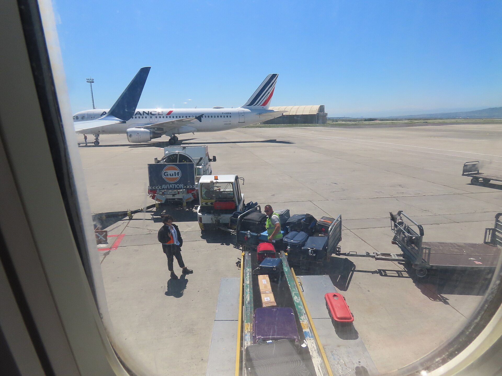 Suitcases being loaded onto an aircraft
